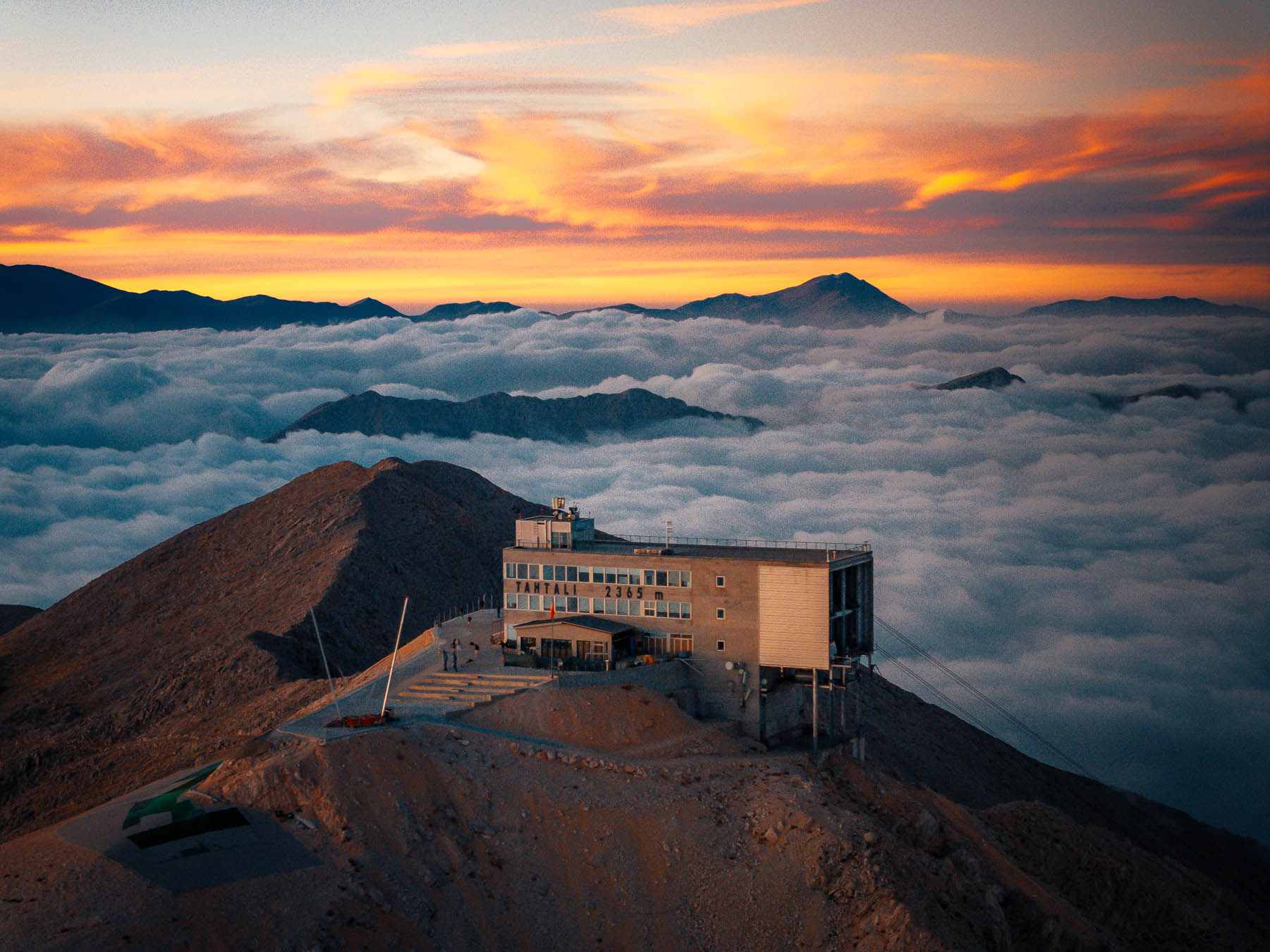 The Tahtalı summit station above a sea of clouds at sunset