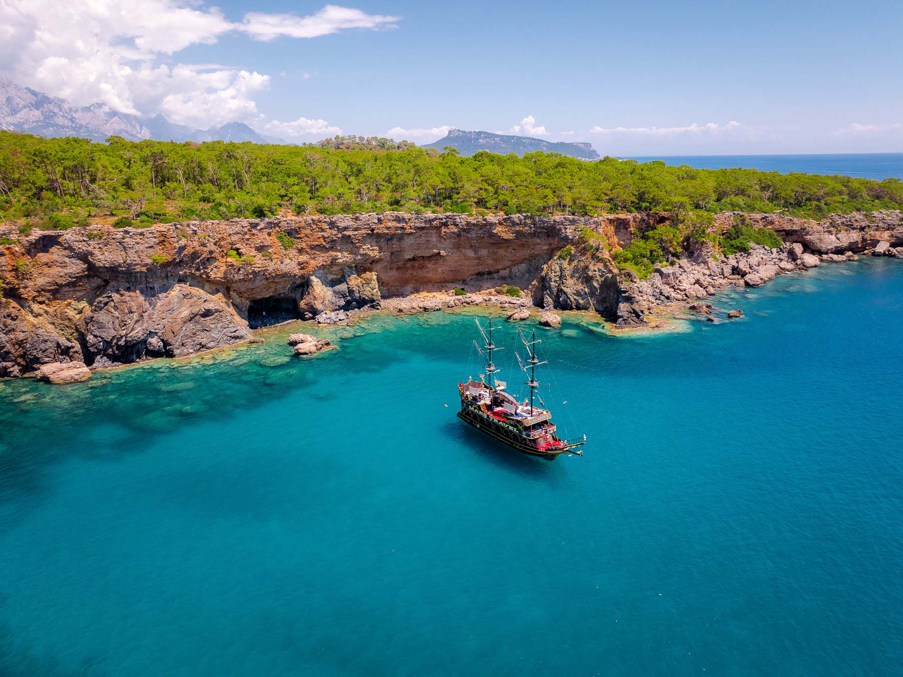 A gulet anchored in a turquoise bay at Phaselis, on the Antalya coast