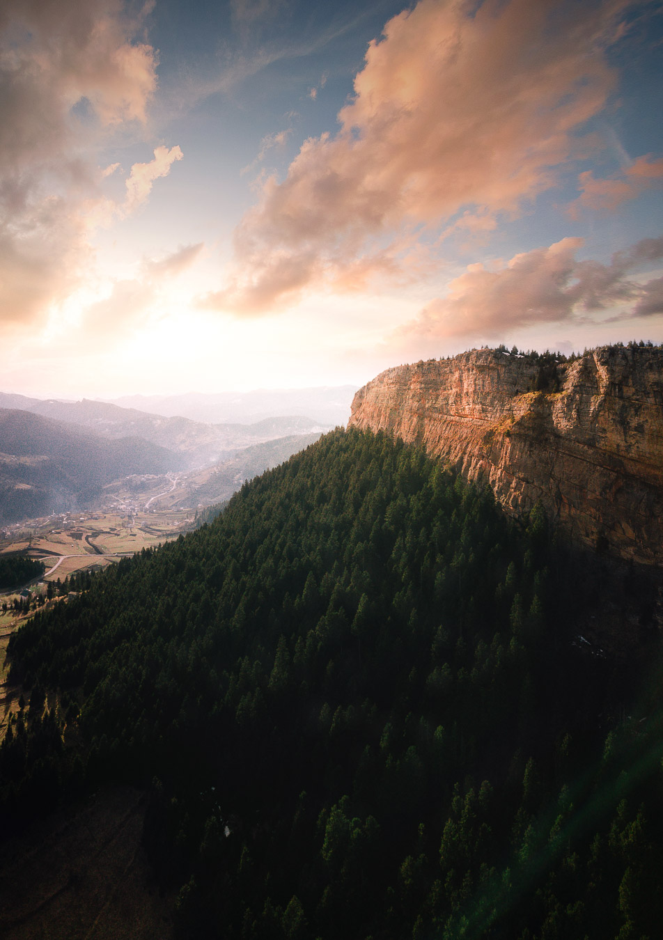 Sunset light over the cliffs and forested ridges of Düzköy